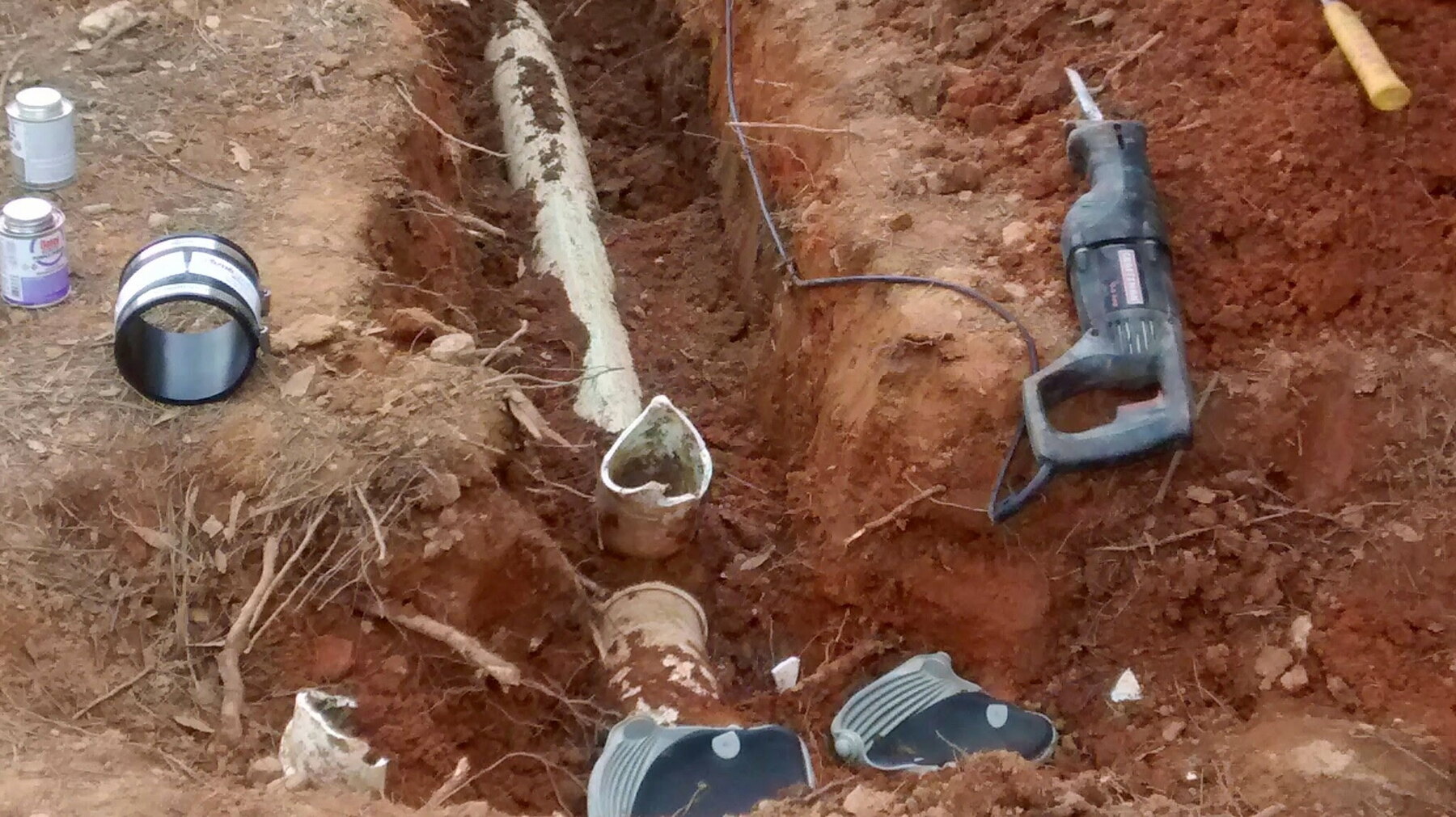 Sewer line excavation and pipe repair