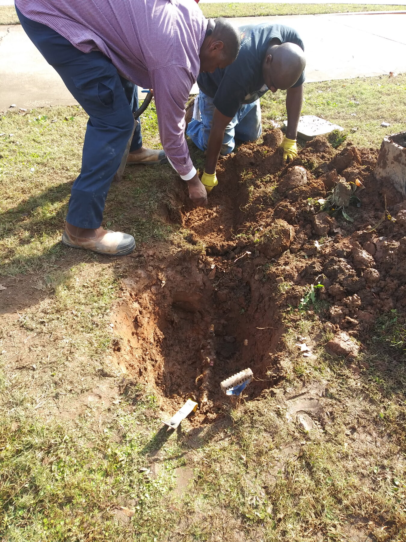 Crew digging for a sewer line repair